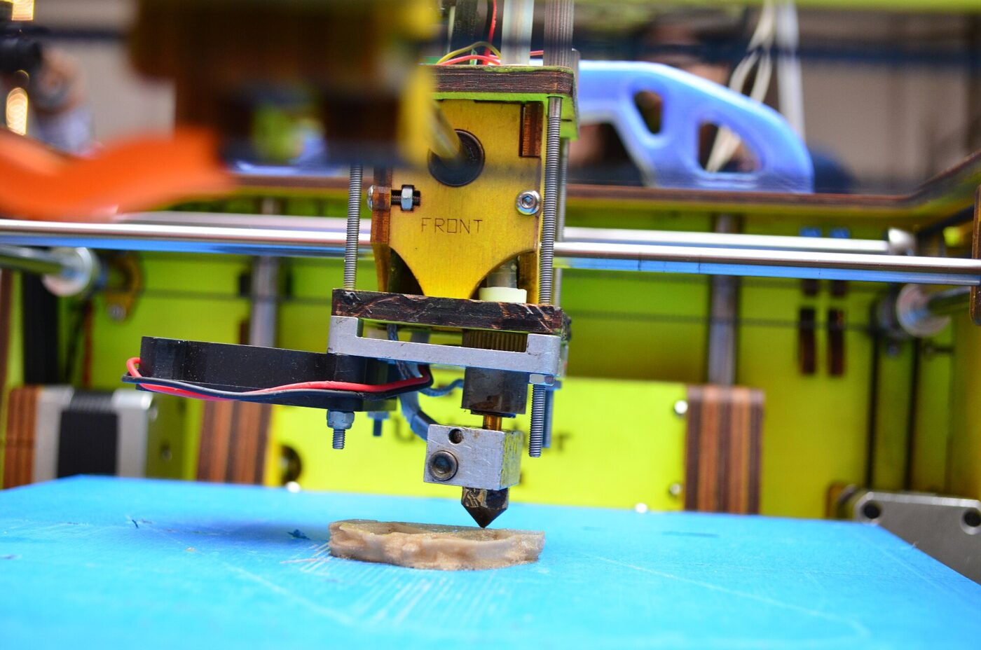 A 3D printer laying down its first layers at Makers Party Bangalore.