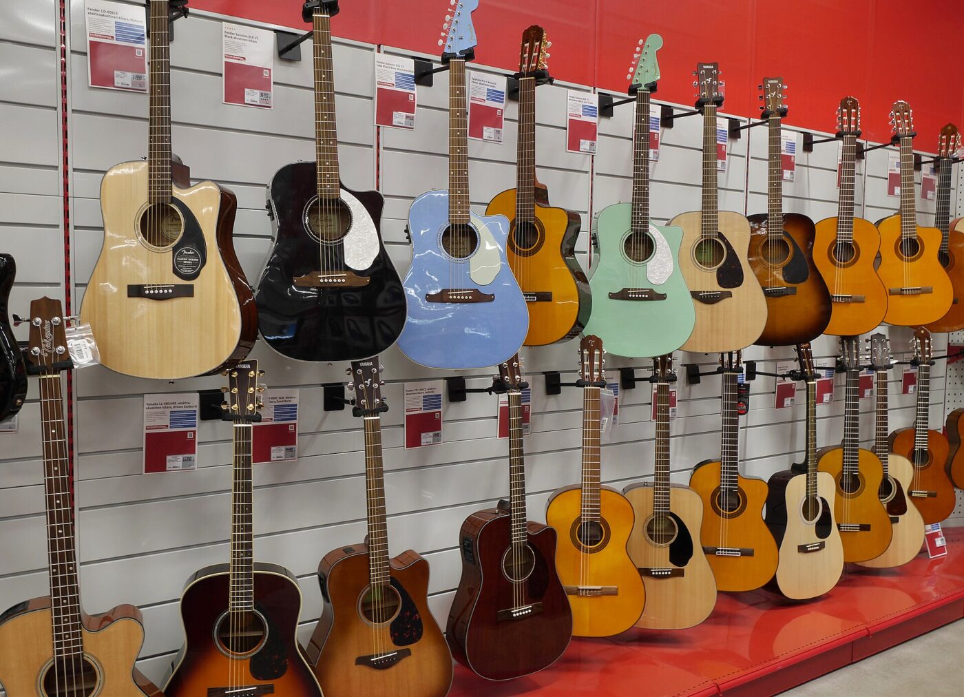 Acoustic guitars on display in a music shop.