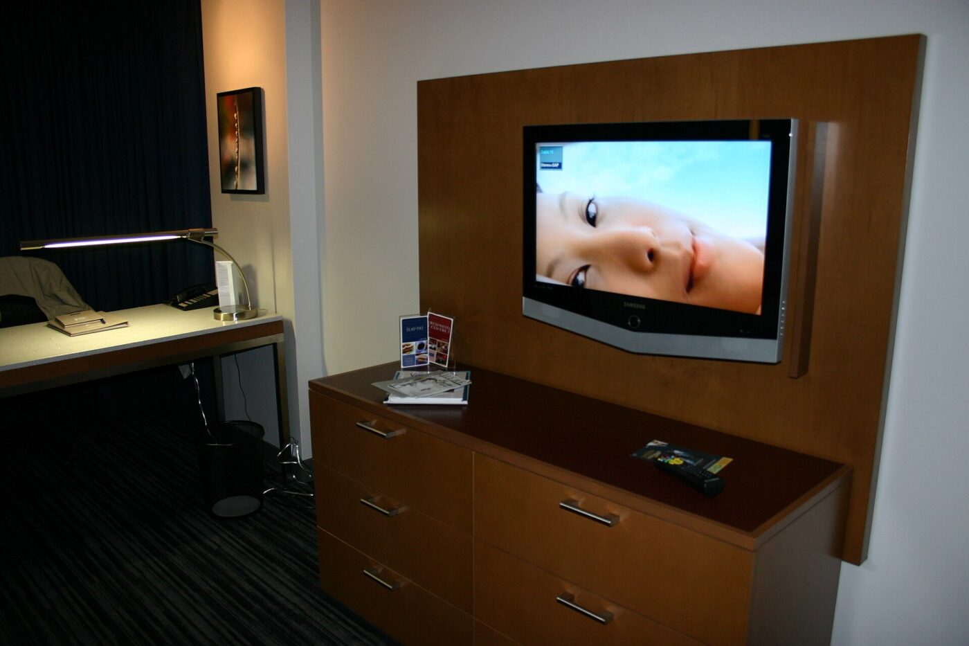 A wall-mounted flat-screen television in a modern room.