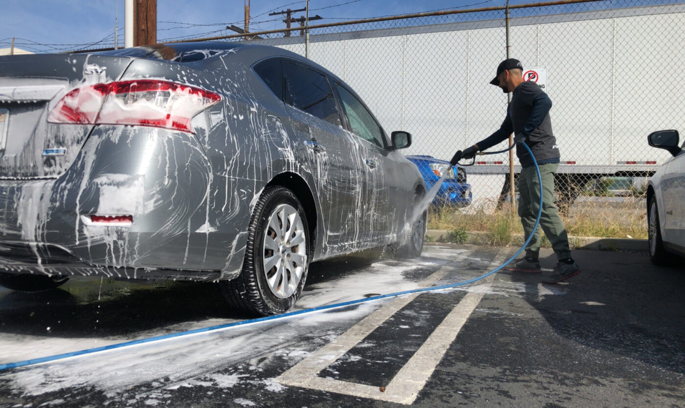 A mobile car wash in progress.