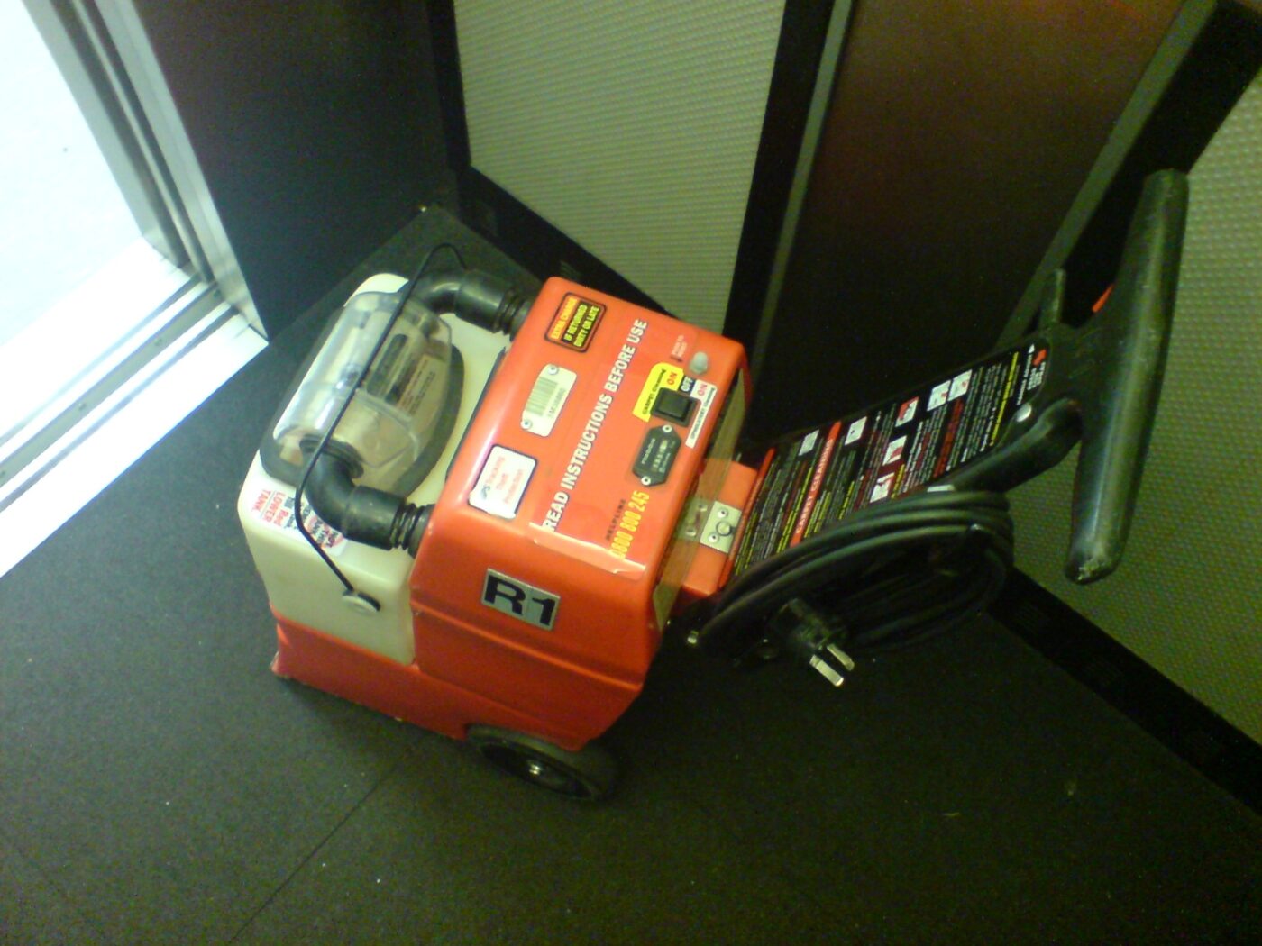 A portable carpet extraction machine.