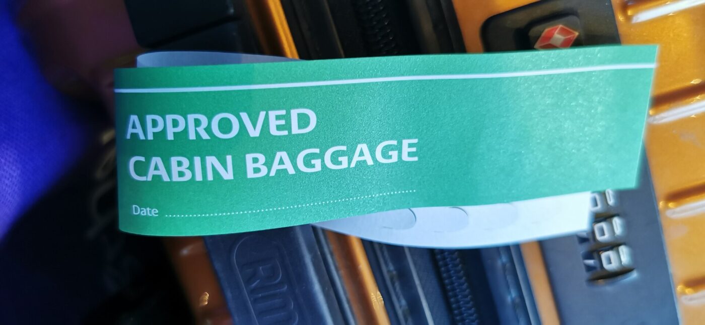 An 'Approved cabin baggage' tag issued by Luxair Services at Luxembourg Airport.