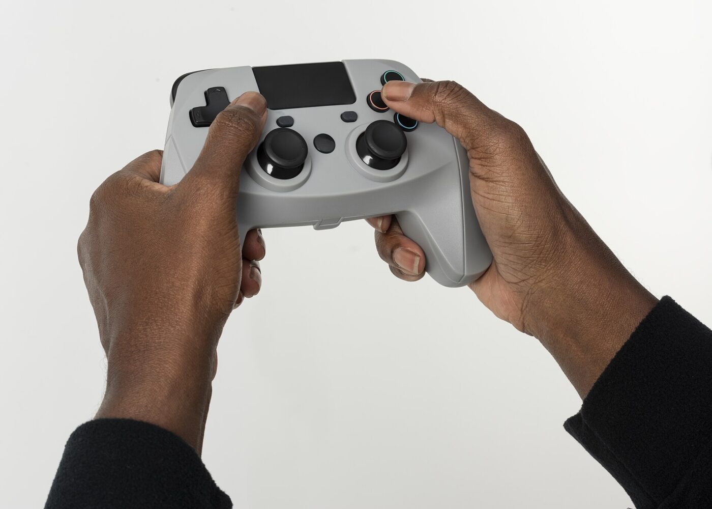 Holding a game controller. The thumbsticks take constant pressure and wear with it.