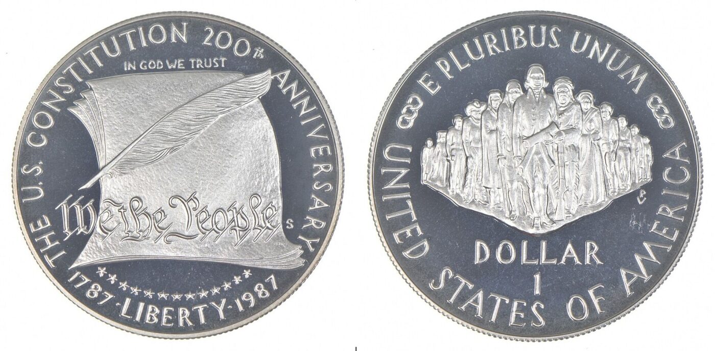 A 1987 US Constitution commemorative silver dollar coin showing its eagle reverse design.