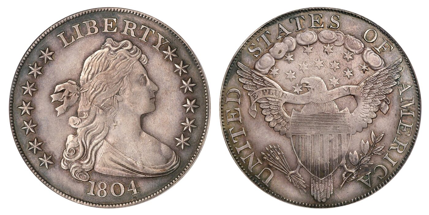 Front and back views of an antique US silver dollar coin showing Liberty and an eagle.