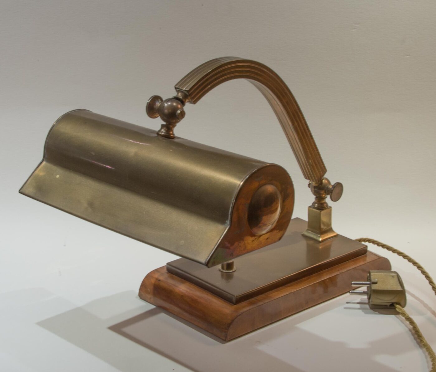 A brass banker's-style desk lamp.