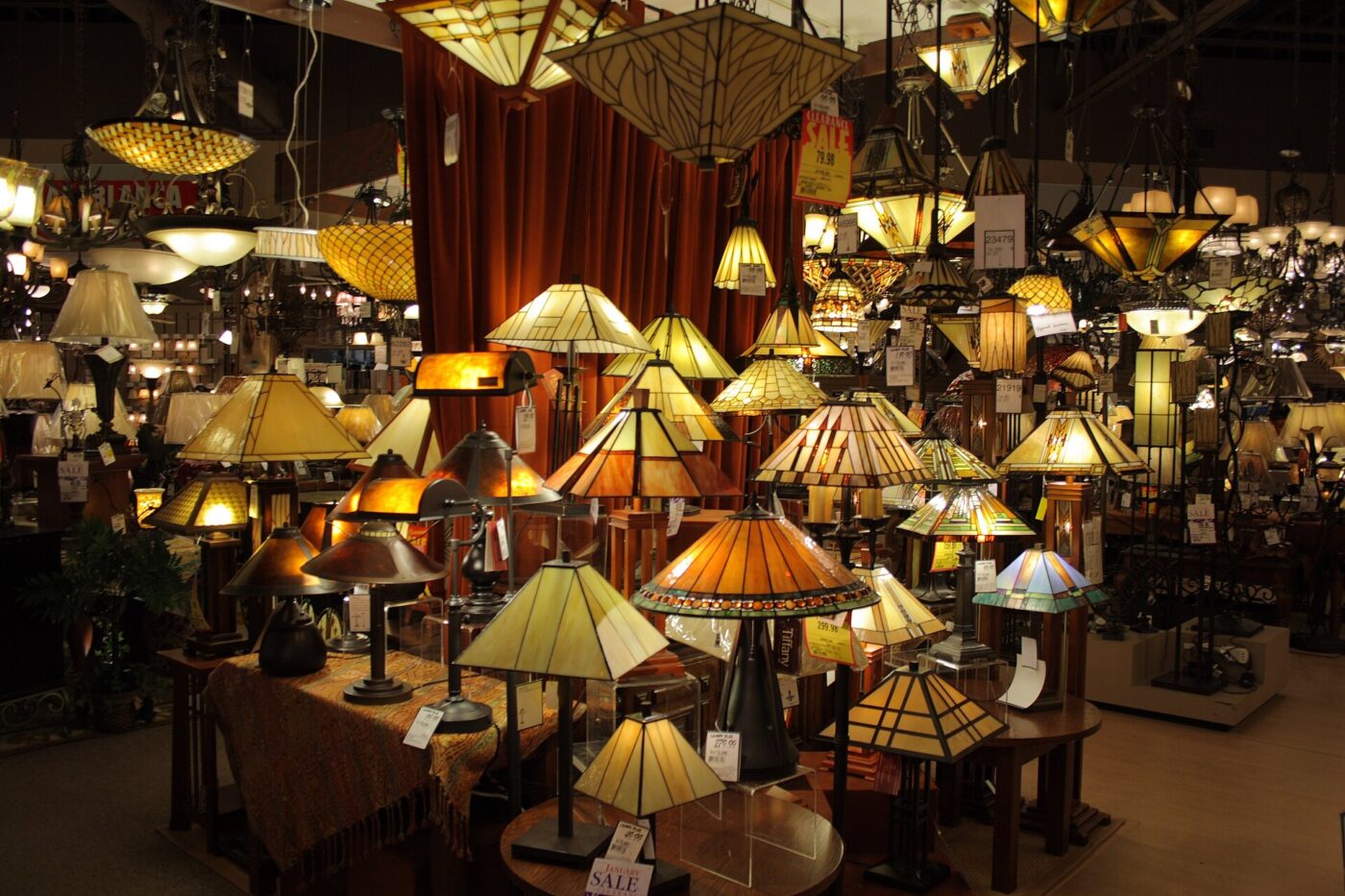 A wide array of lamps on display in a shop.