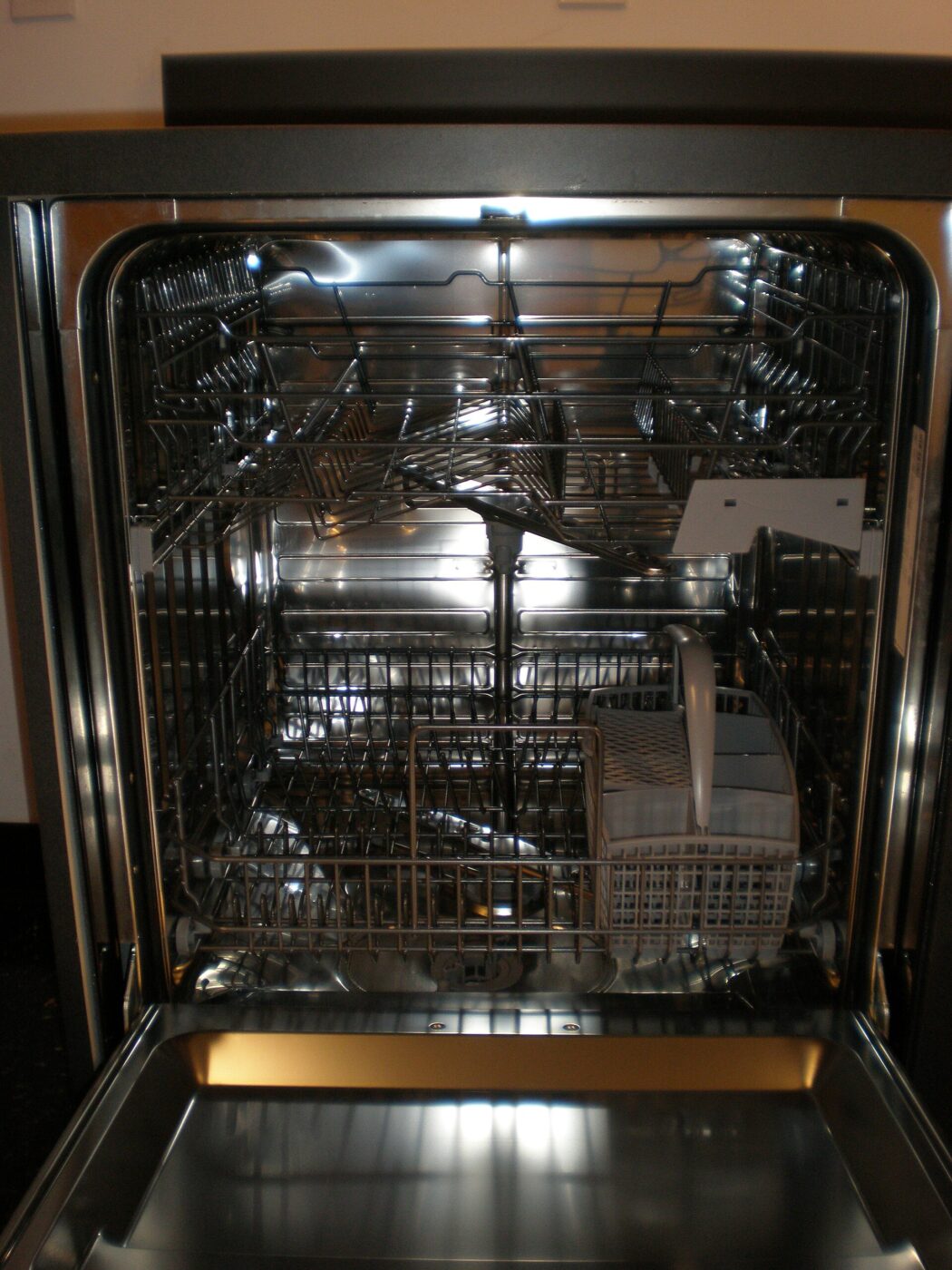 An Asko dishwasher with the door open.
