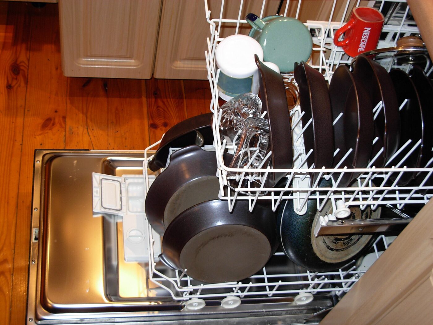 A dishwasher loaded with dishes.