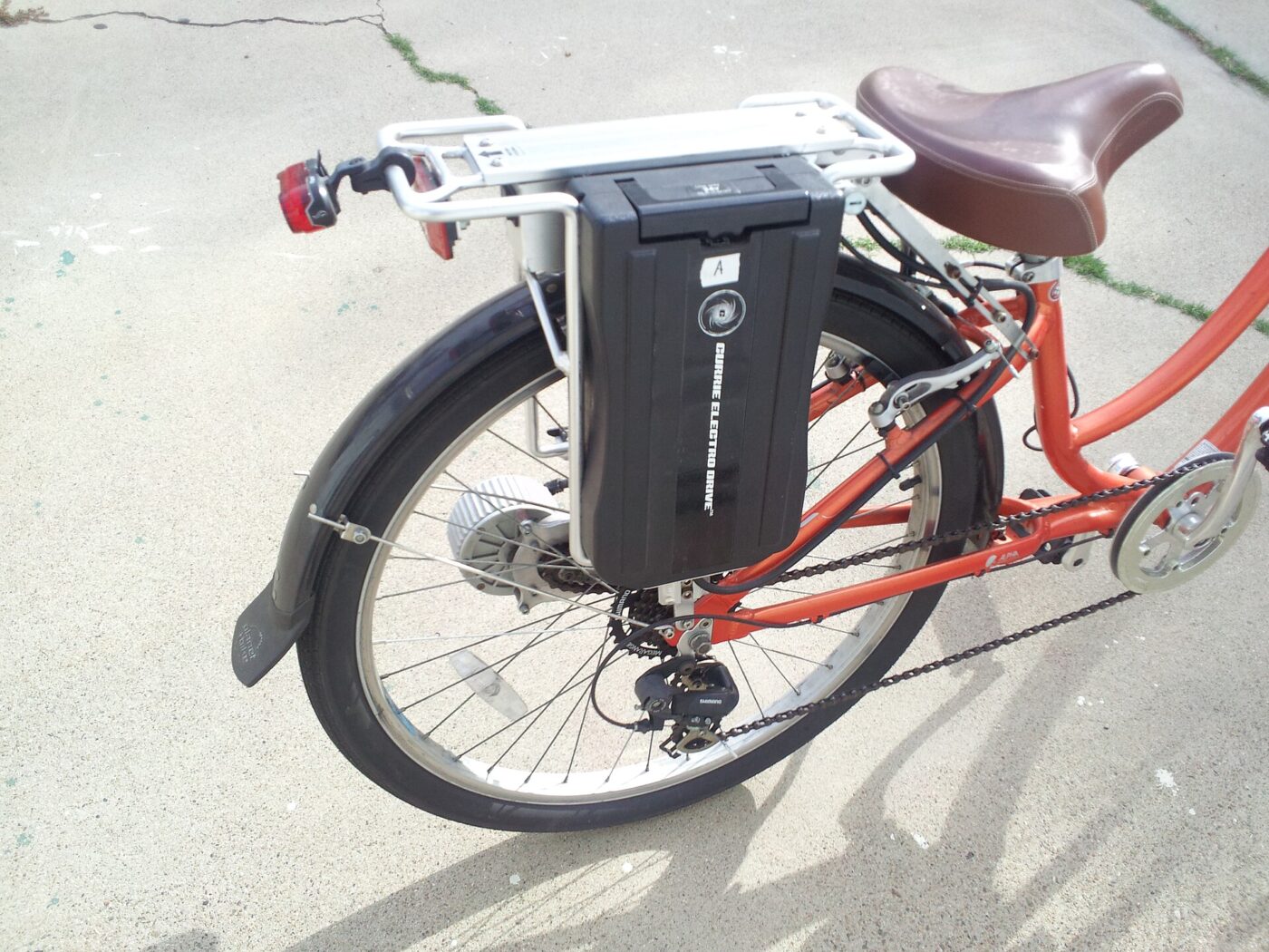 An electric bicycle with a rack-mounted battery.