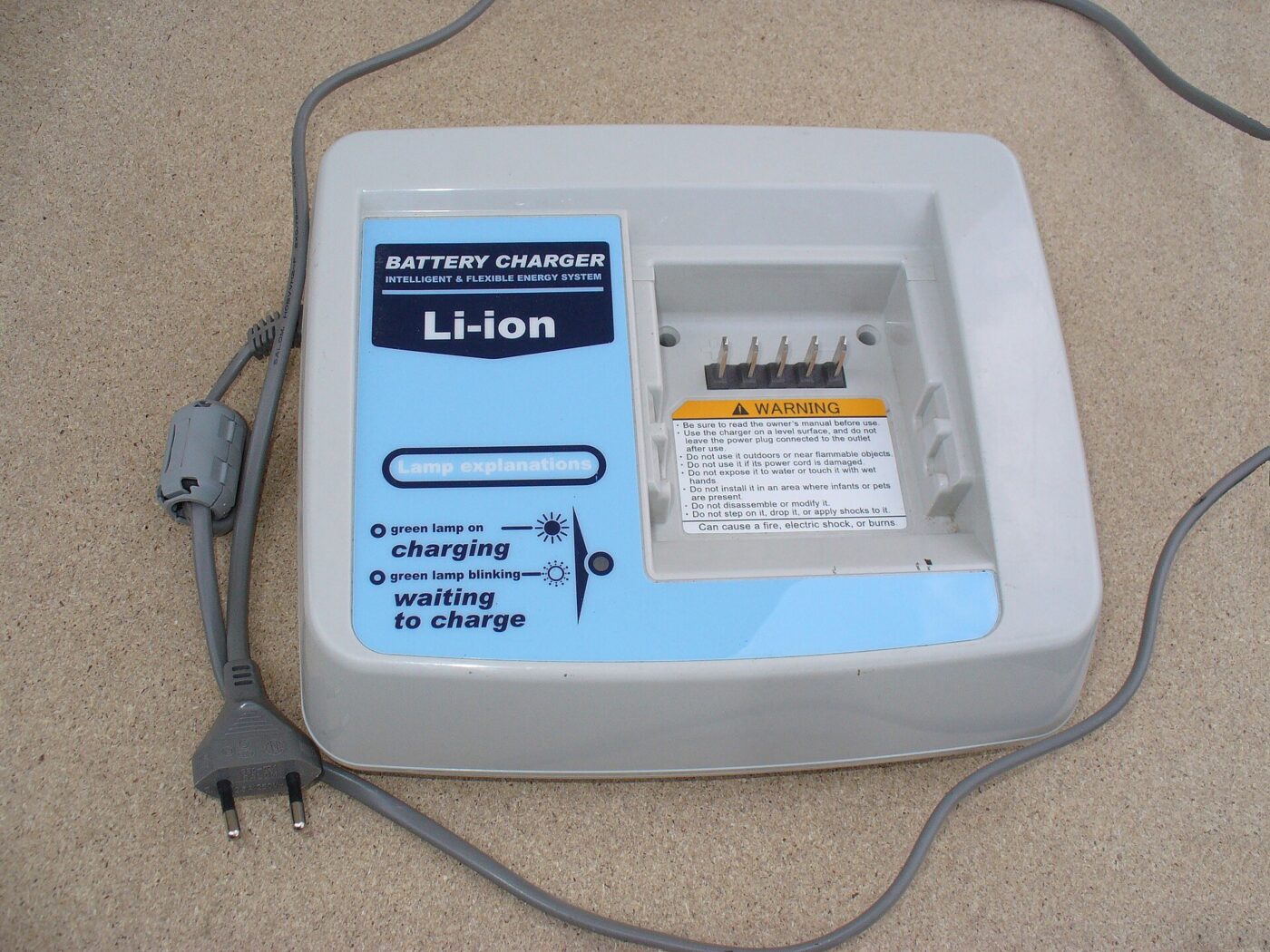 An e-bike battery on its charger.