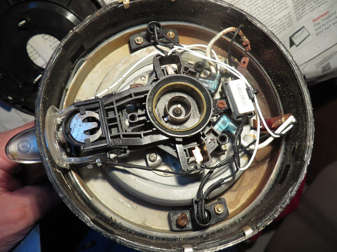 The underside of an electric kettle, opened up.