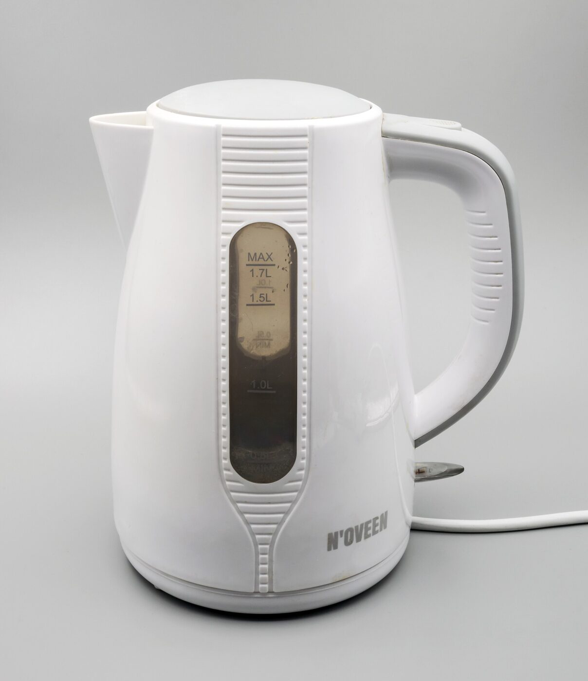 A white electric kettle with a digital display, no cord or plug visible.