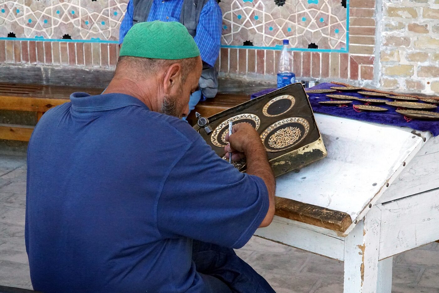 An engraver working on a metal plate in Bukhara, Uzbekistan.