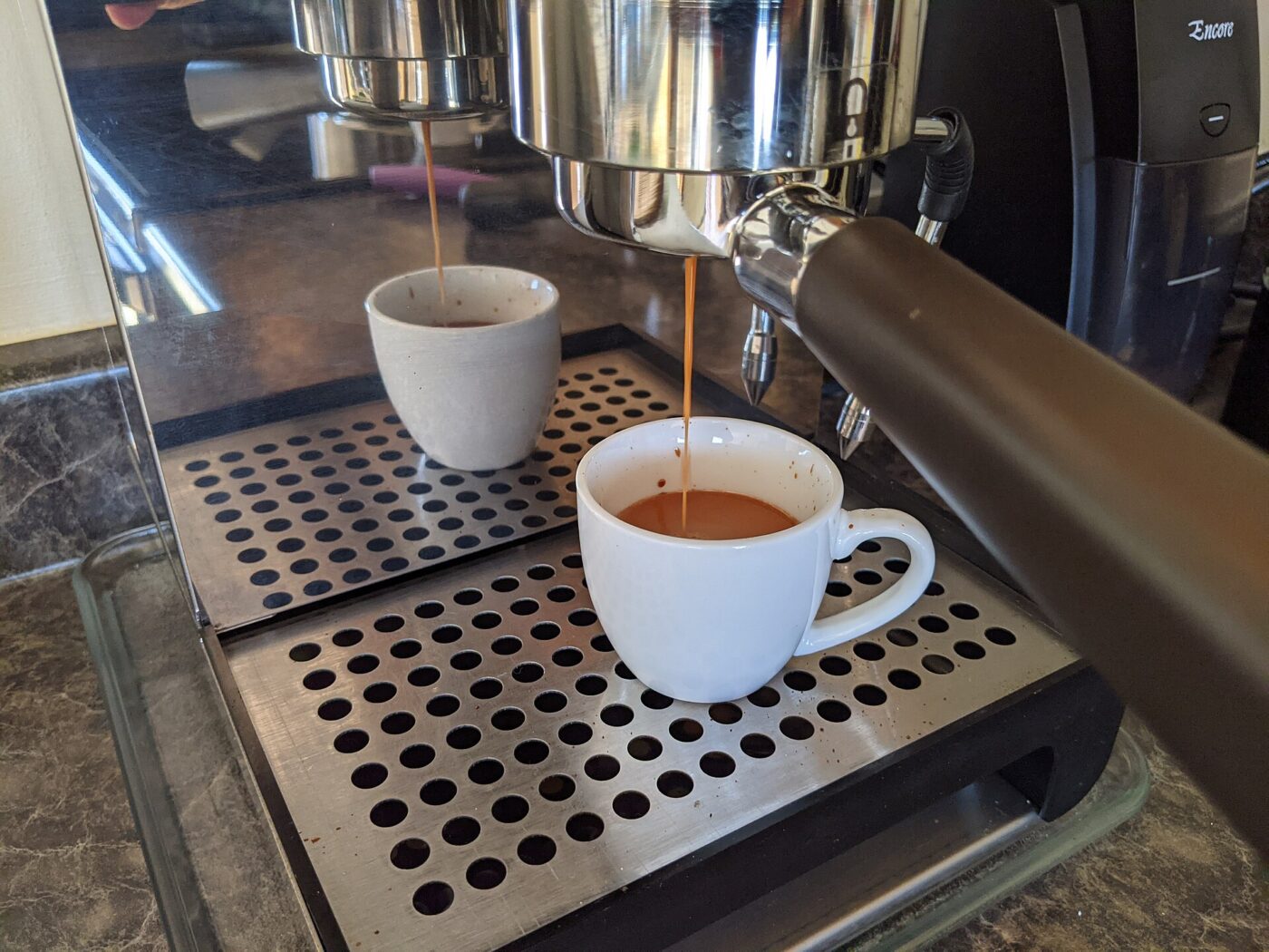 Espresso pouring from a home machine.