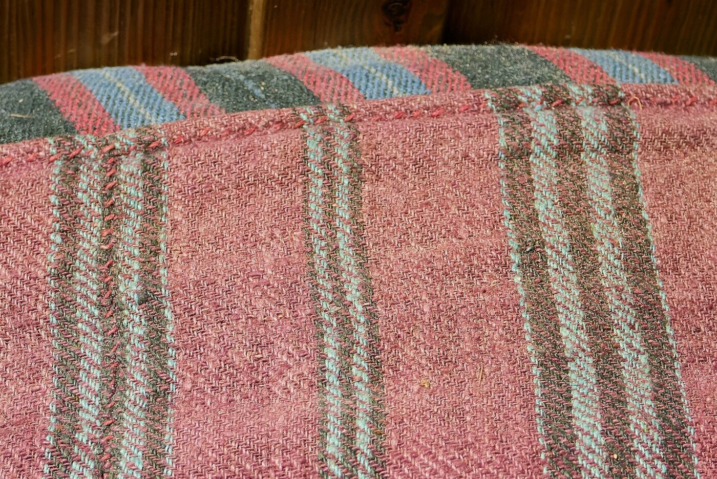 Striped fabric texture from a mattress cover, close up.