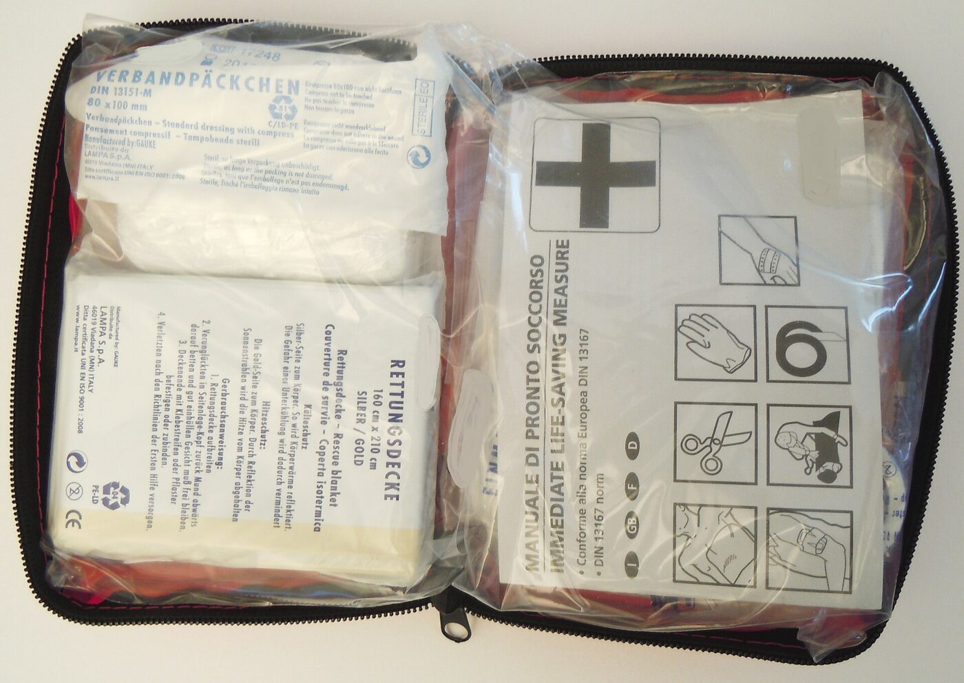 An opened compact first aid kit.