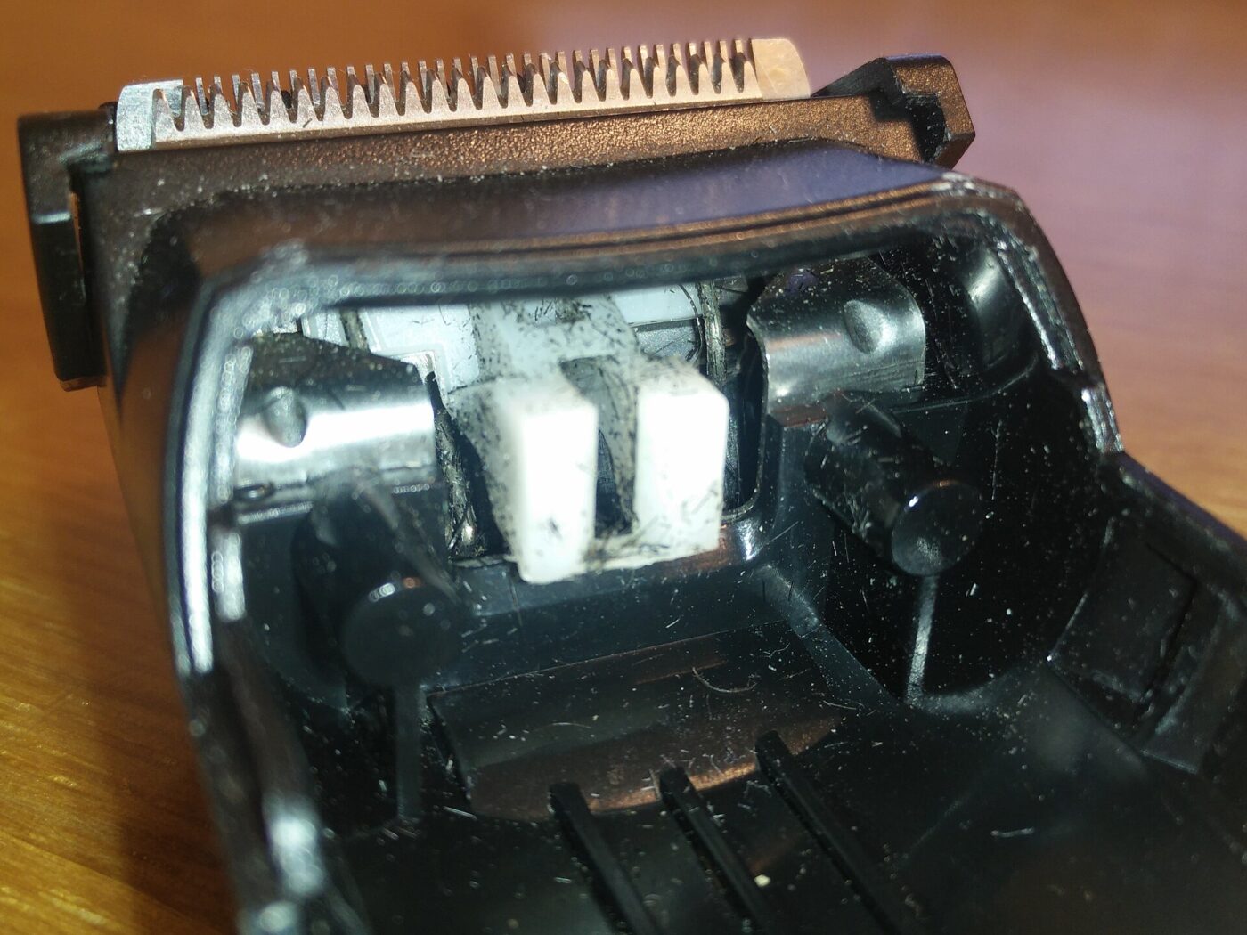 Stubble trapped under the cutters of a foil shaver head.