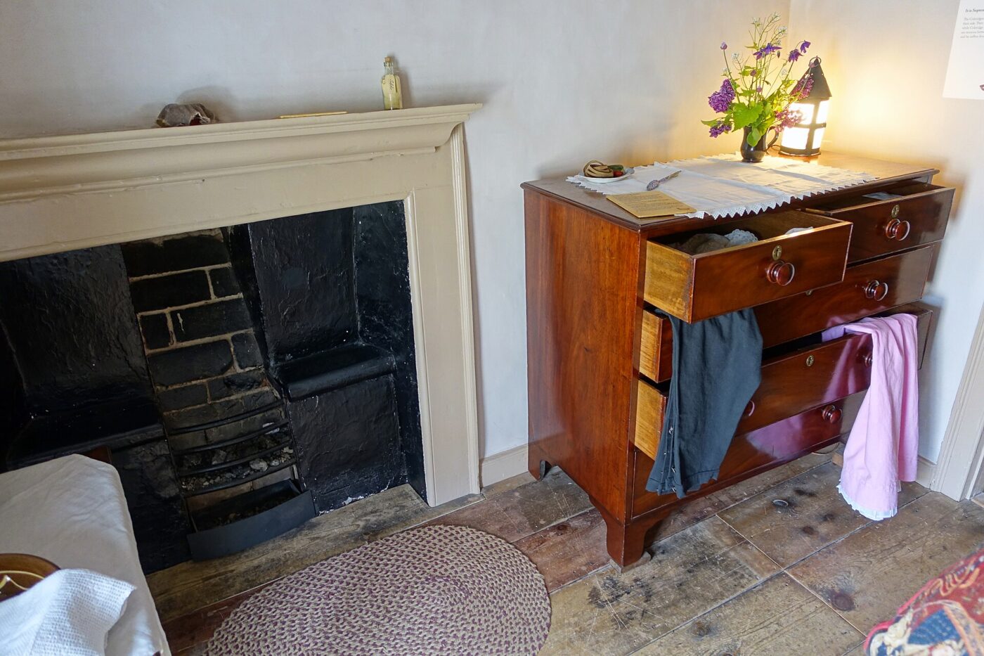 A chest of drawers in a bedroom.
