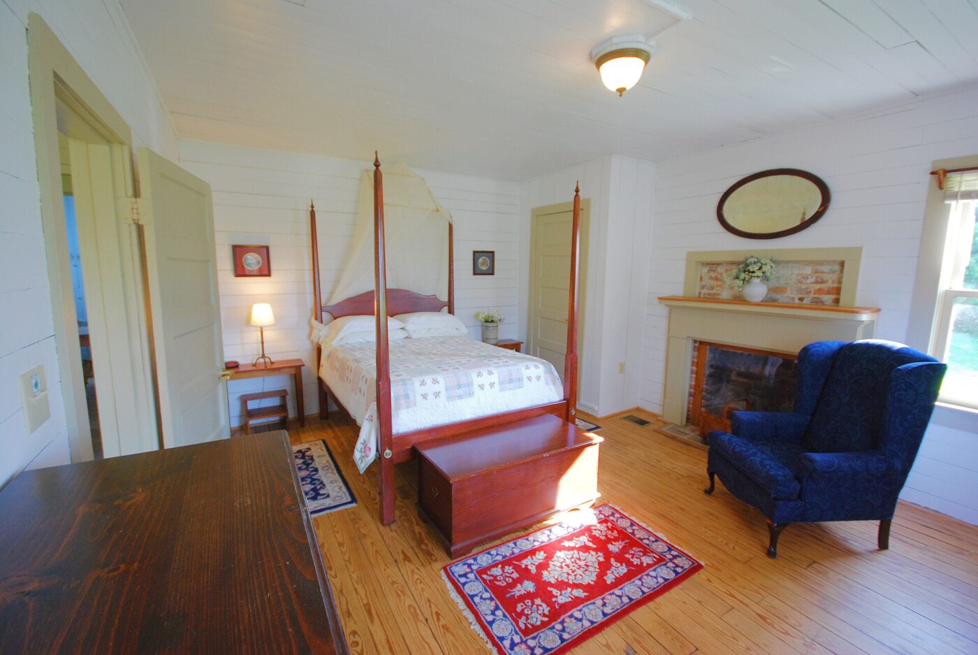 A furnished bedroom with freestanding furniture.