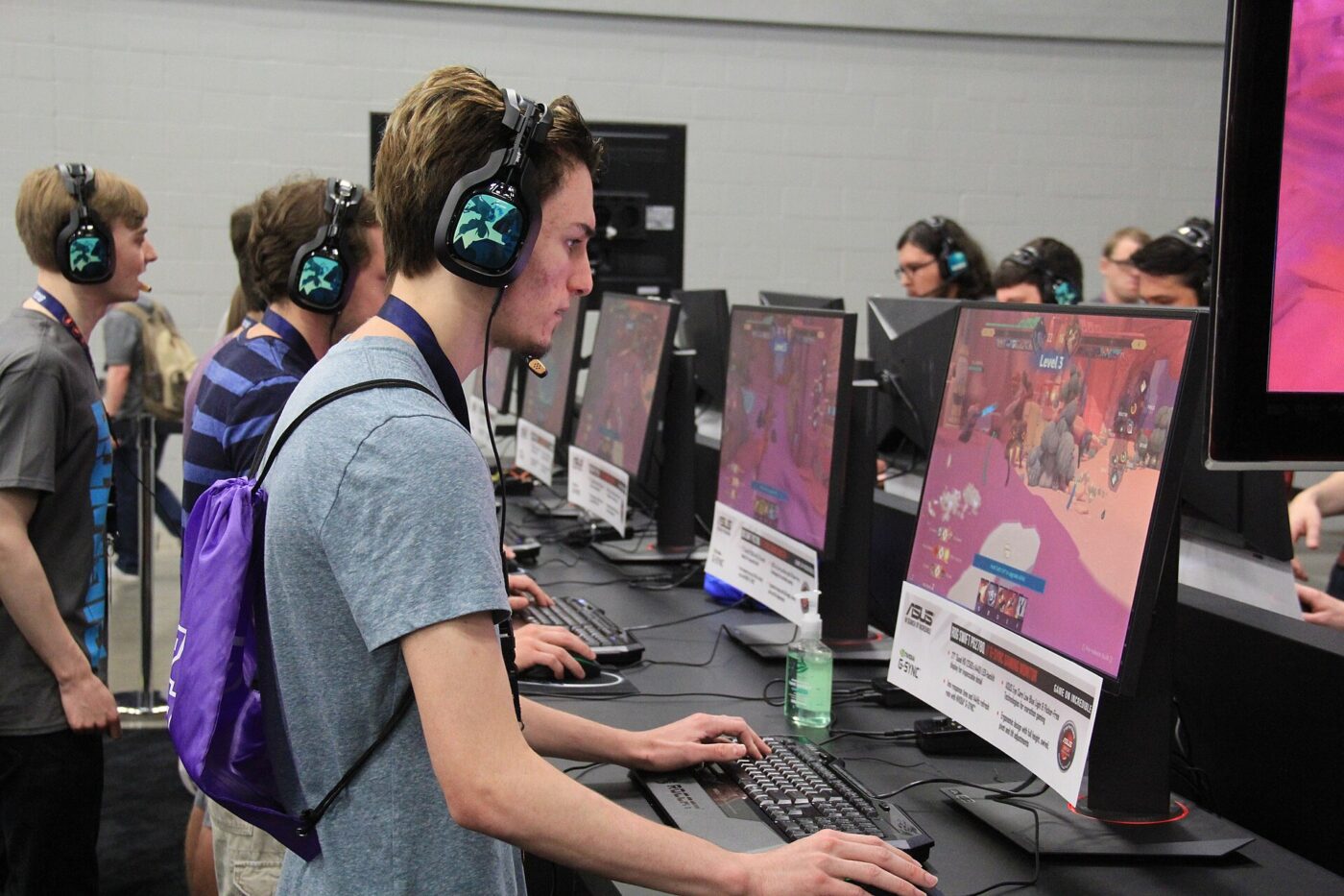 Players wearing gaming headsets at a LAN event.