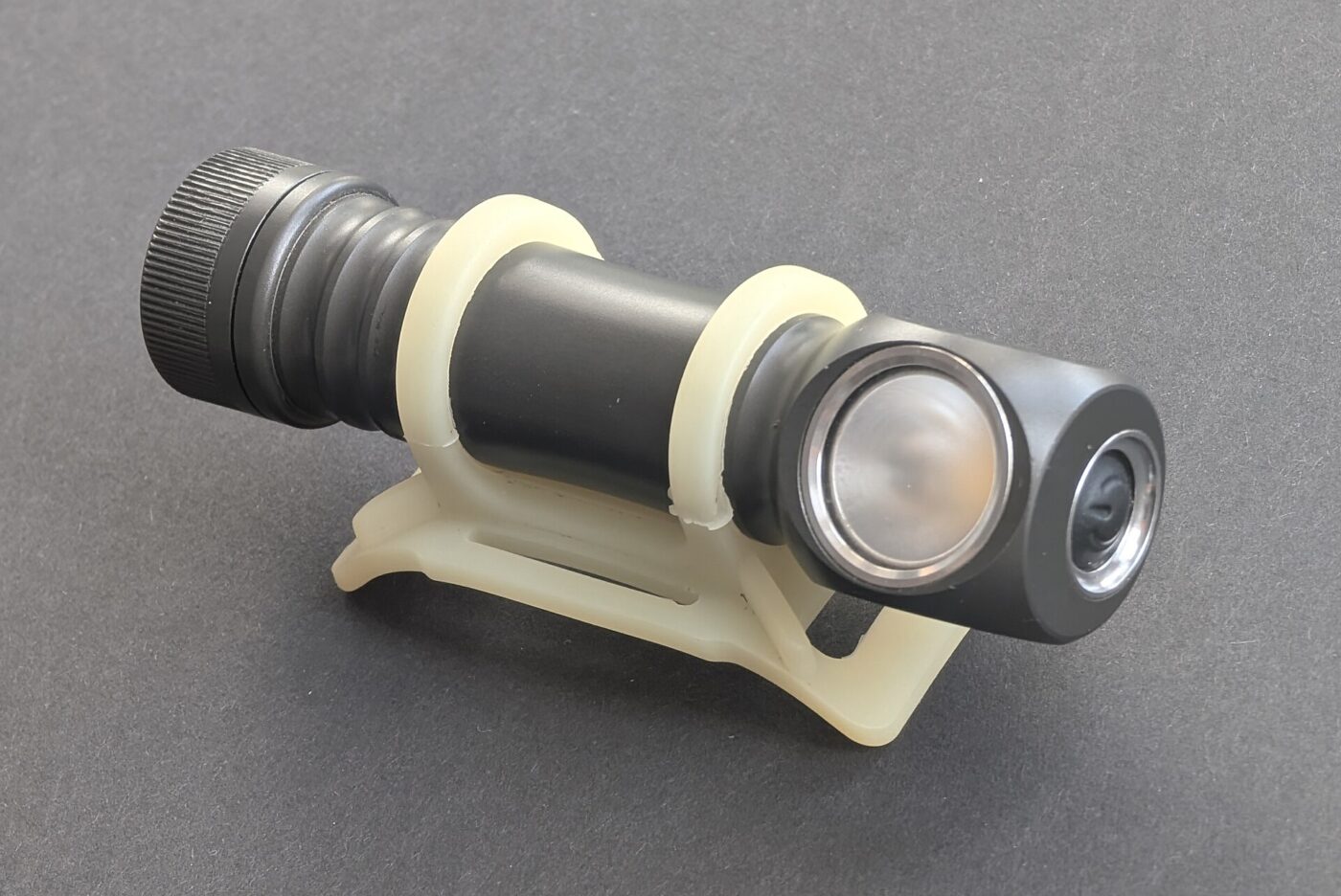 A Zebralight H600Fc headlamp in a silicone holder.