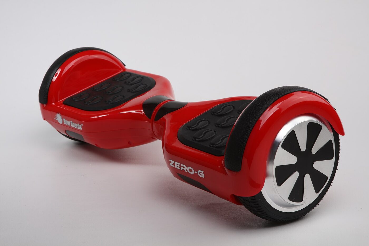 A red hoverboard shown at an angle on a plain background.