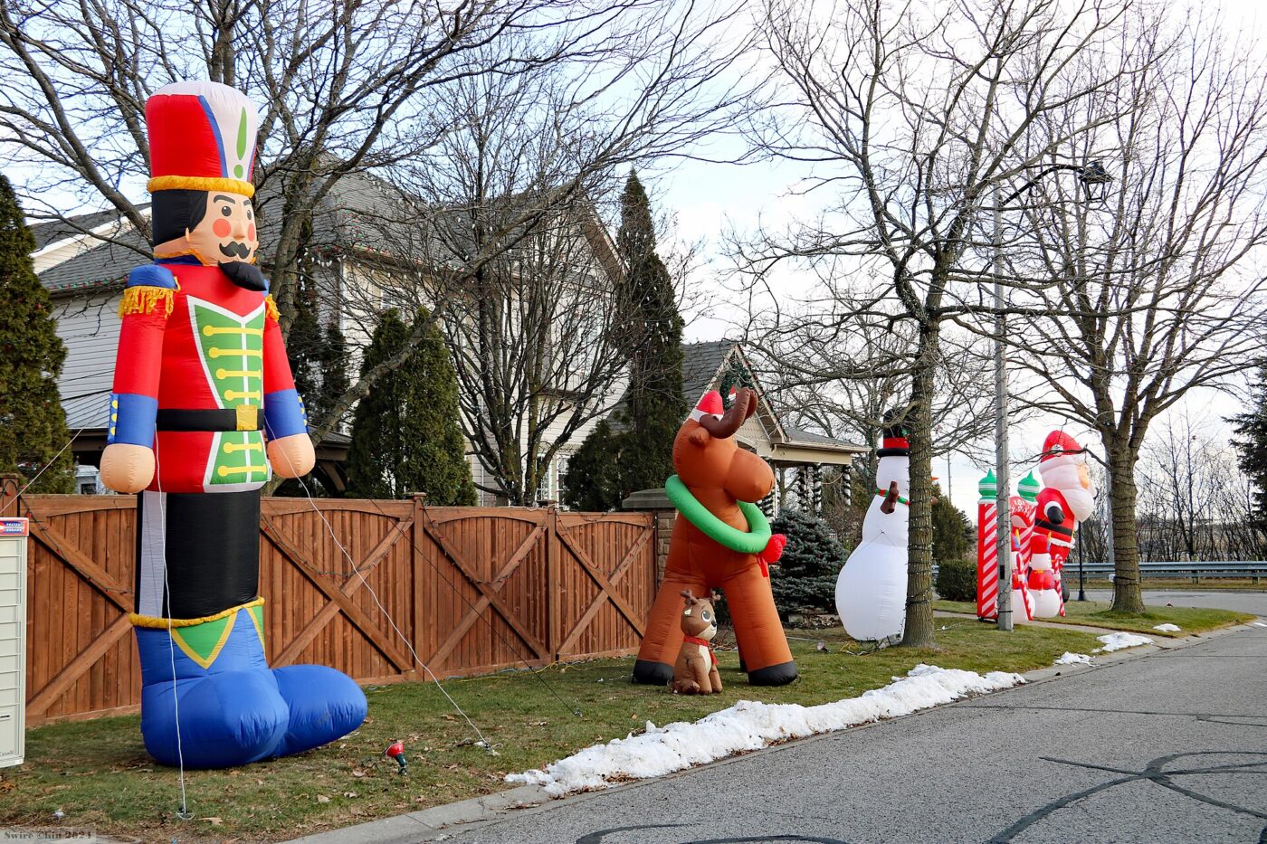 A large inflatable decoration in a front yard.
