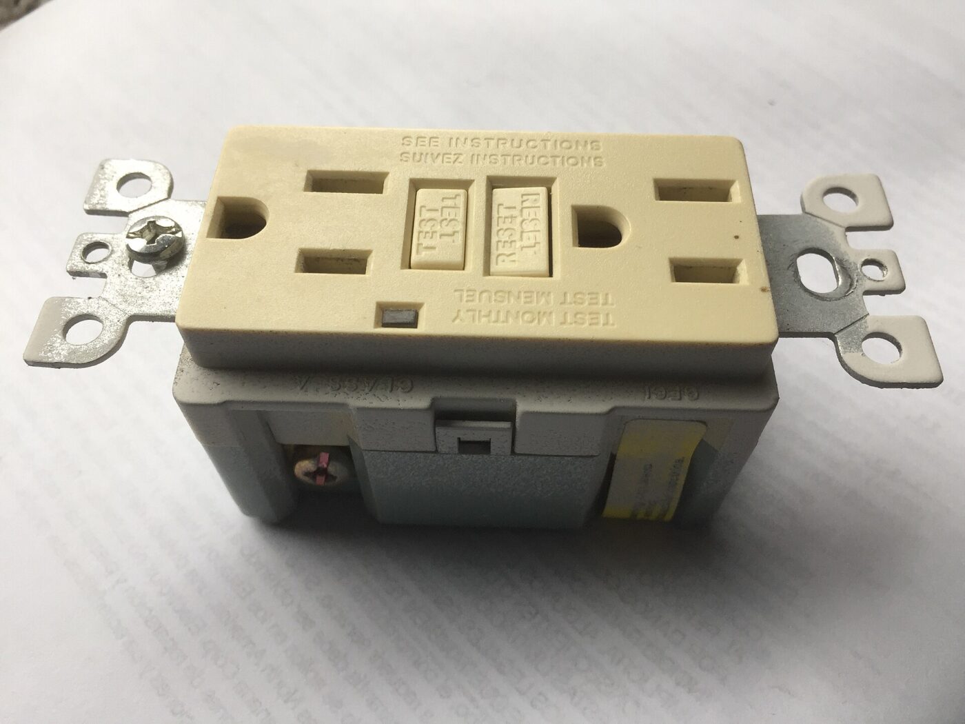 A GFCI outlet, which cuts power when it detects current leaking to ground.
