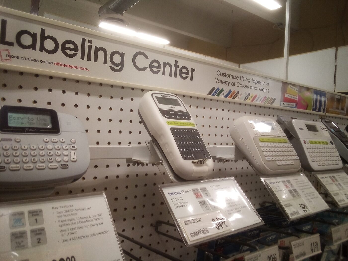Label makers and tape cartridges on sale at an office supply store.