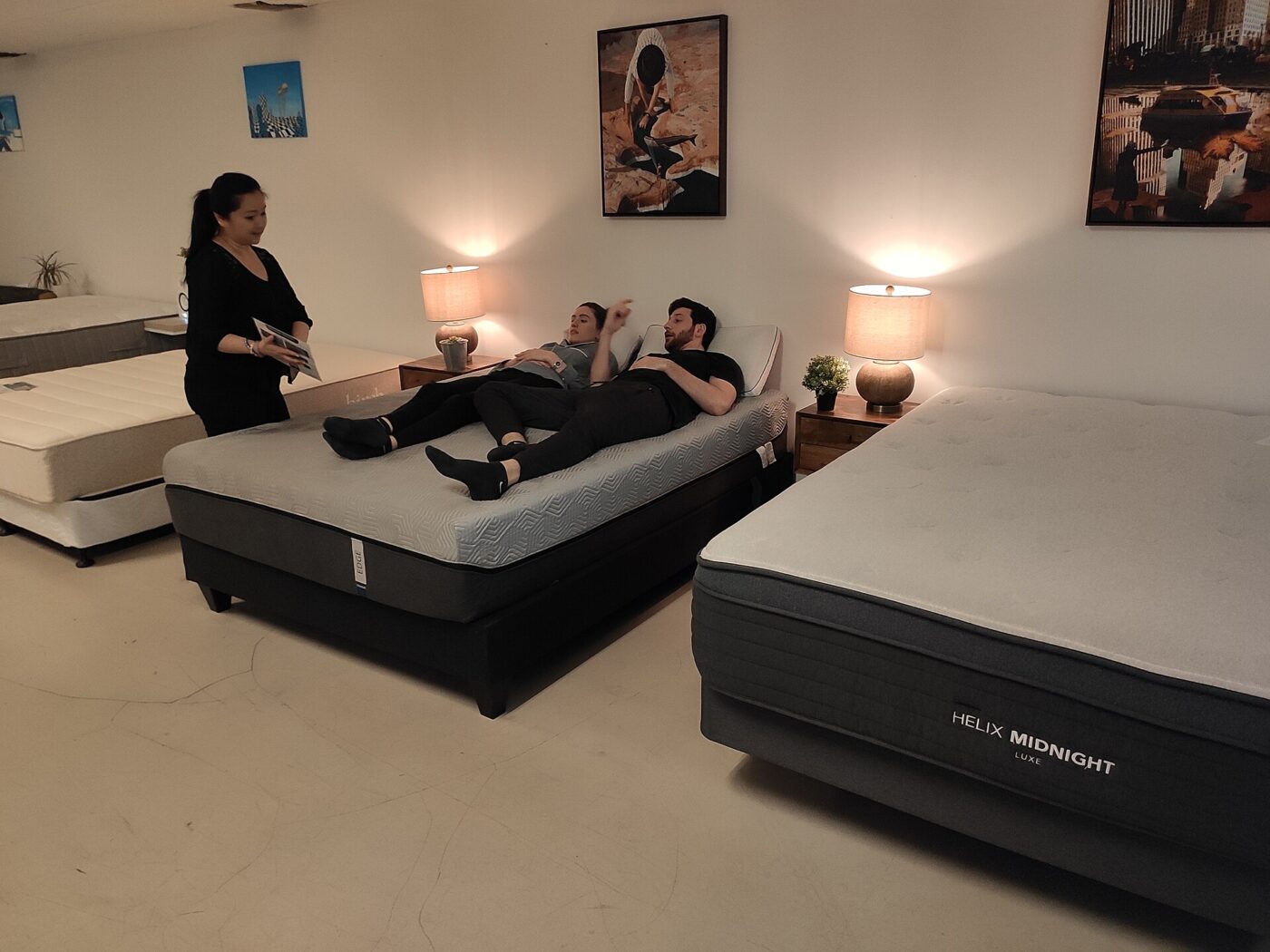 Customers testing beds at a mattress store in New York.