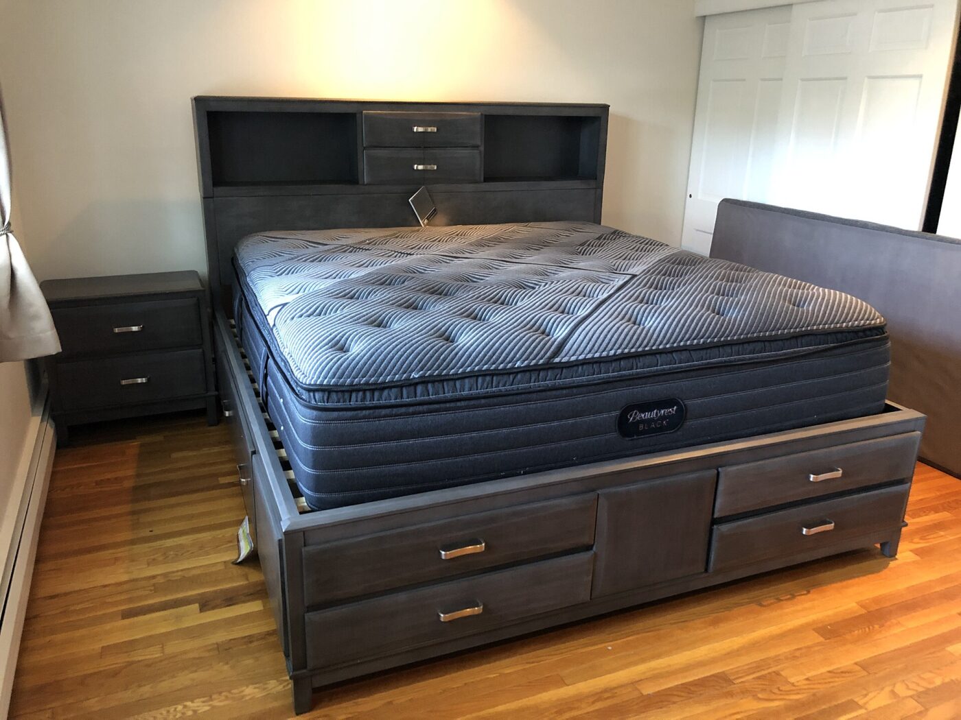 A king-size storage bed with a Beautyrest Black mattress in a New Jersey home.