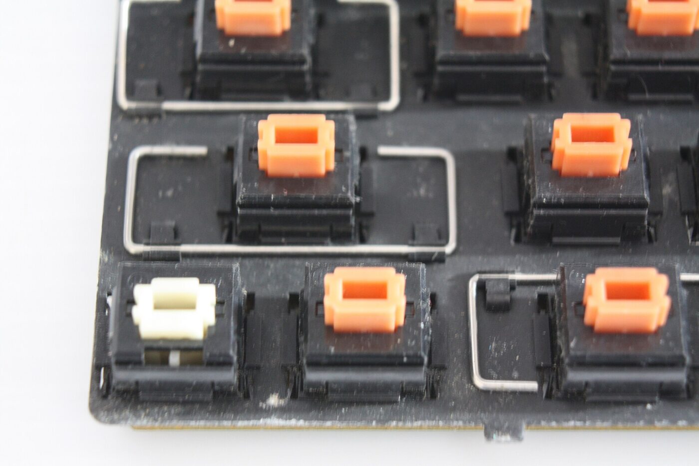 Alps switches on an Apple Desktop Bus keyboard, with the keycaps removed.