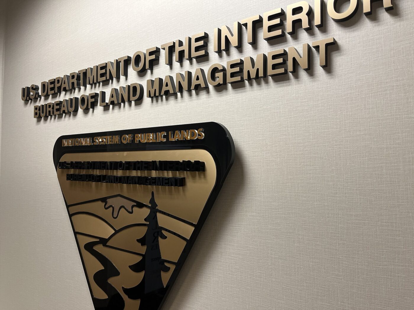 A metal Bureau of Land Management sign reading National System of Public Lands.