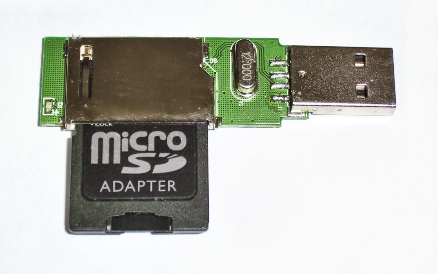 A microSD card seated in a small card reader.