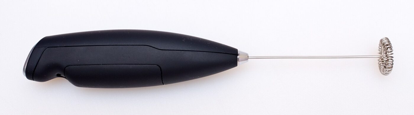 A battery-powered handheld milk frother.