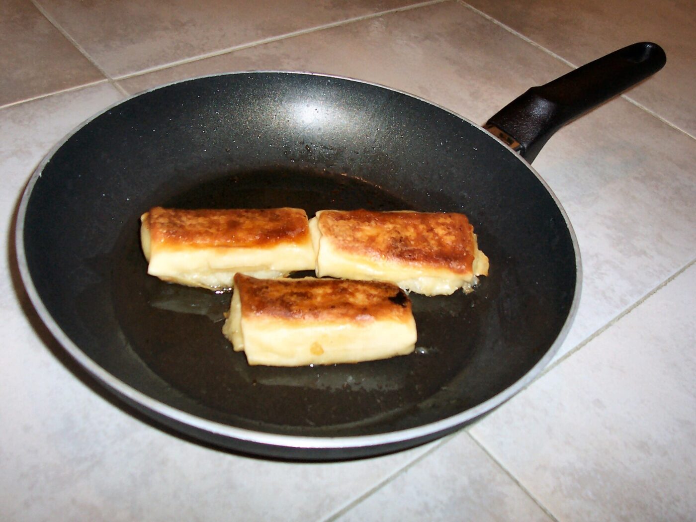 Blintzes browning in a nonstick frying pan. Low to medium heat is what keeps a coating like this going for years.