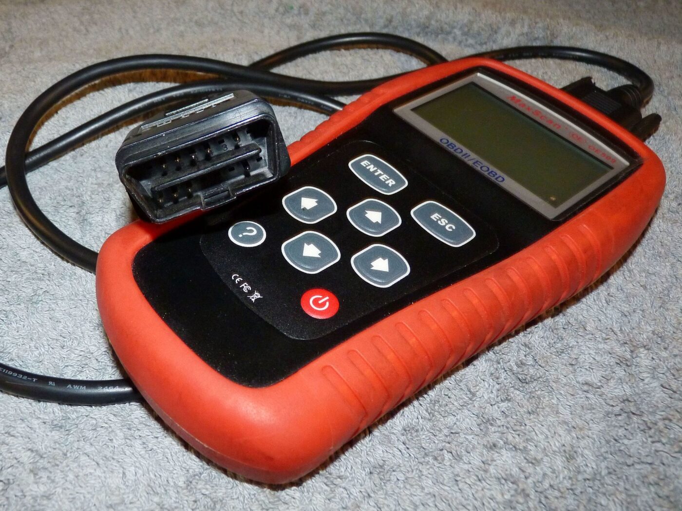 A MaxScan OE509 OBD-II code reader.