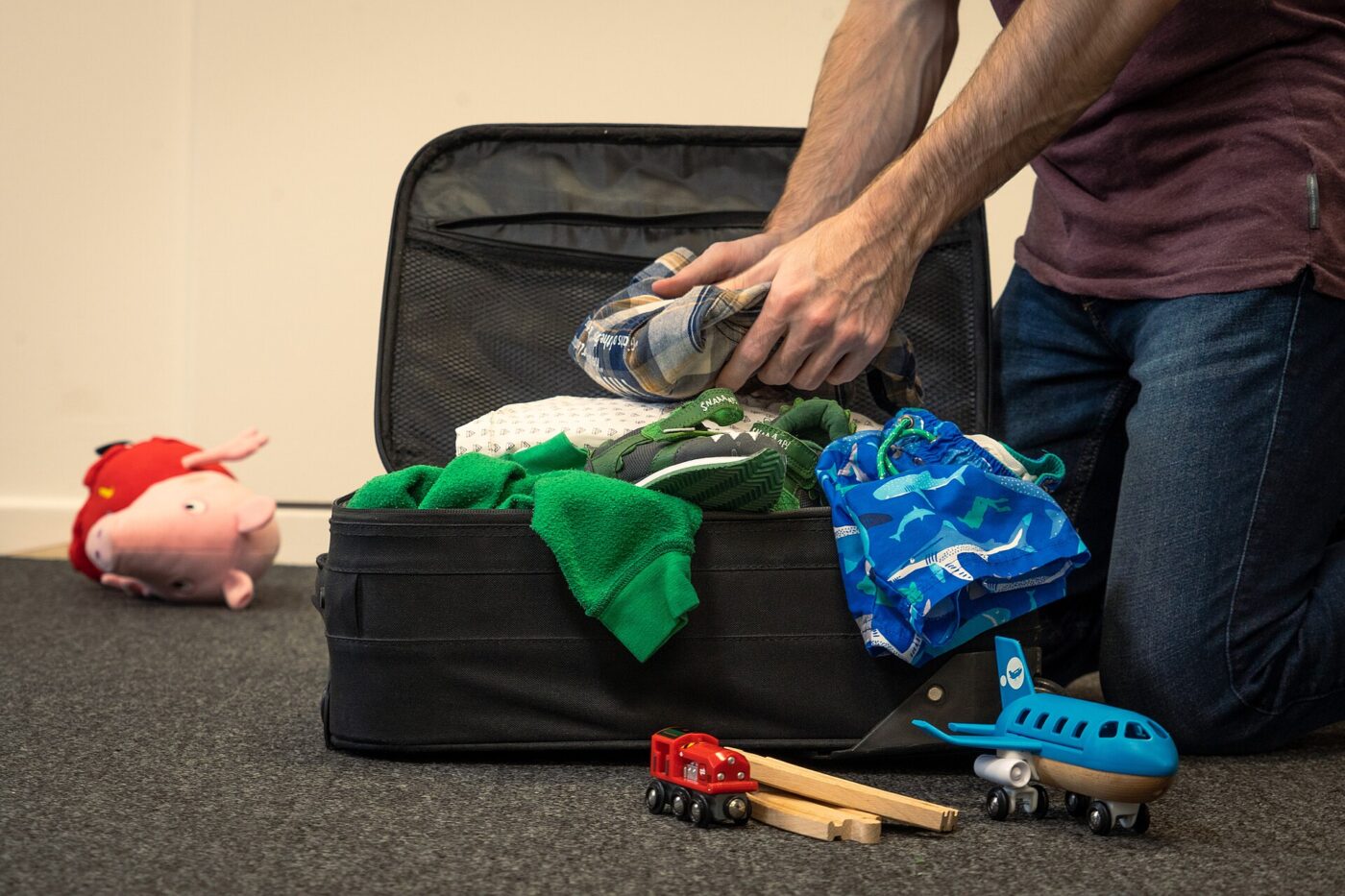 Packing a suitcase for a family holiday.