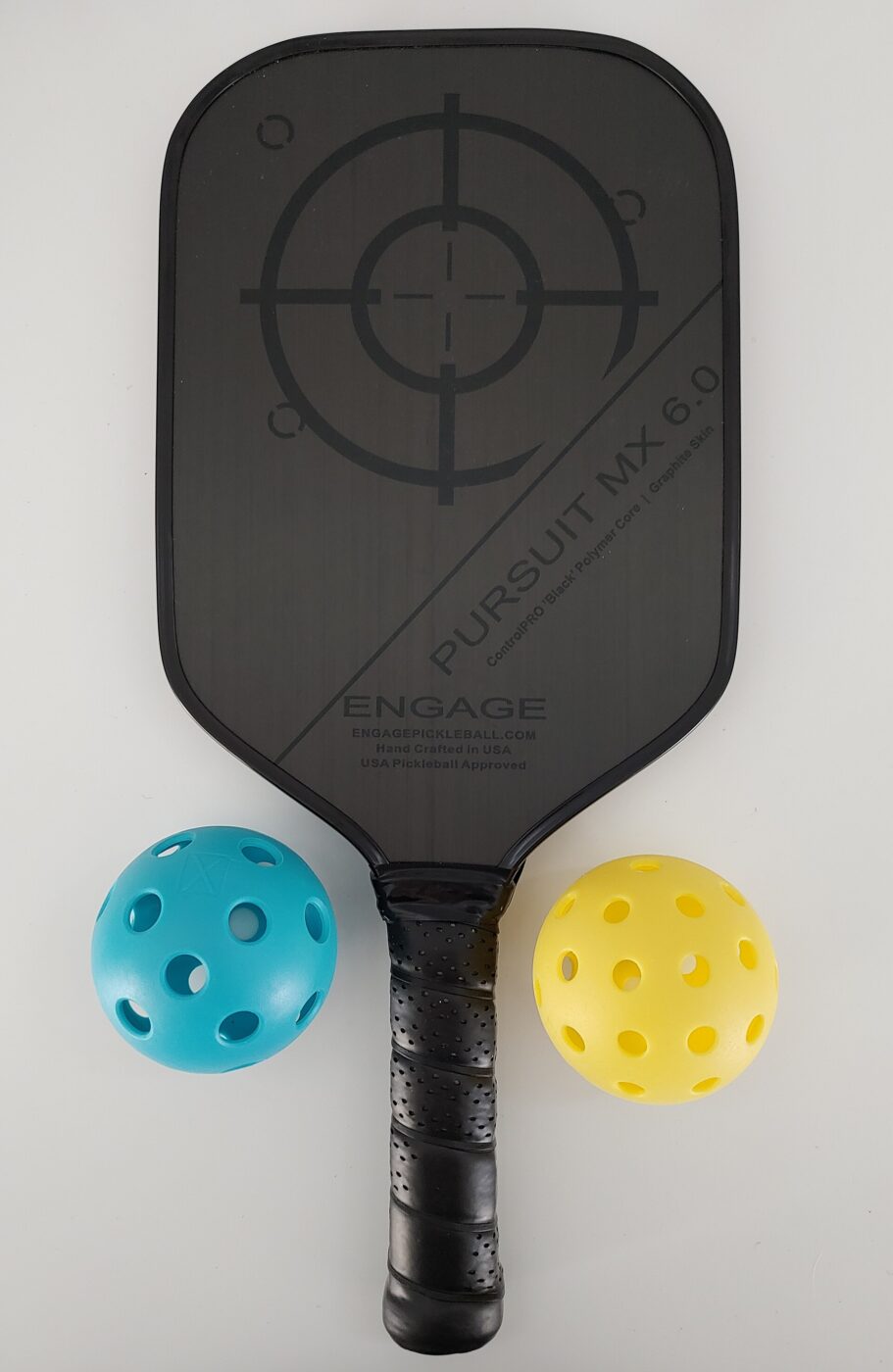 A pickleball paddle with balls.