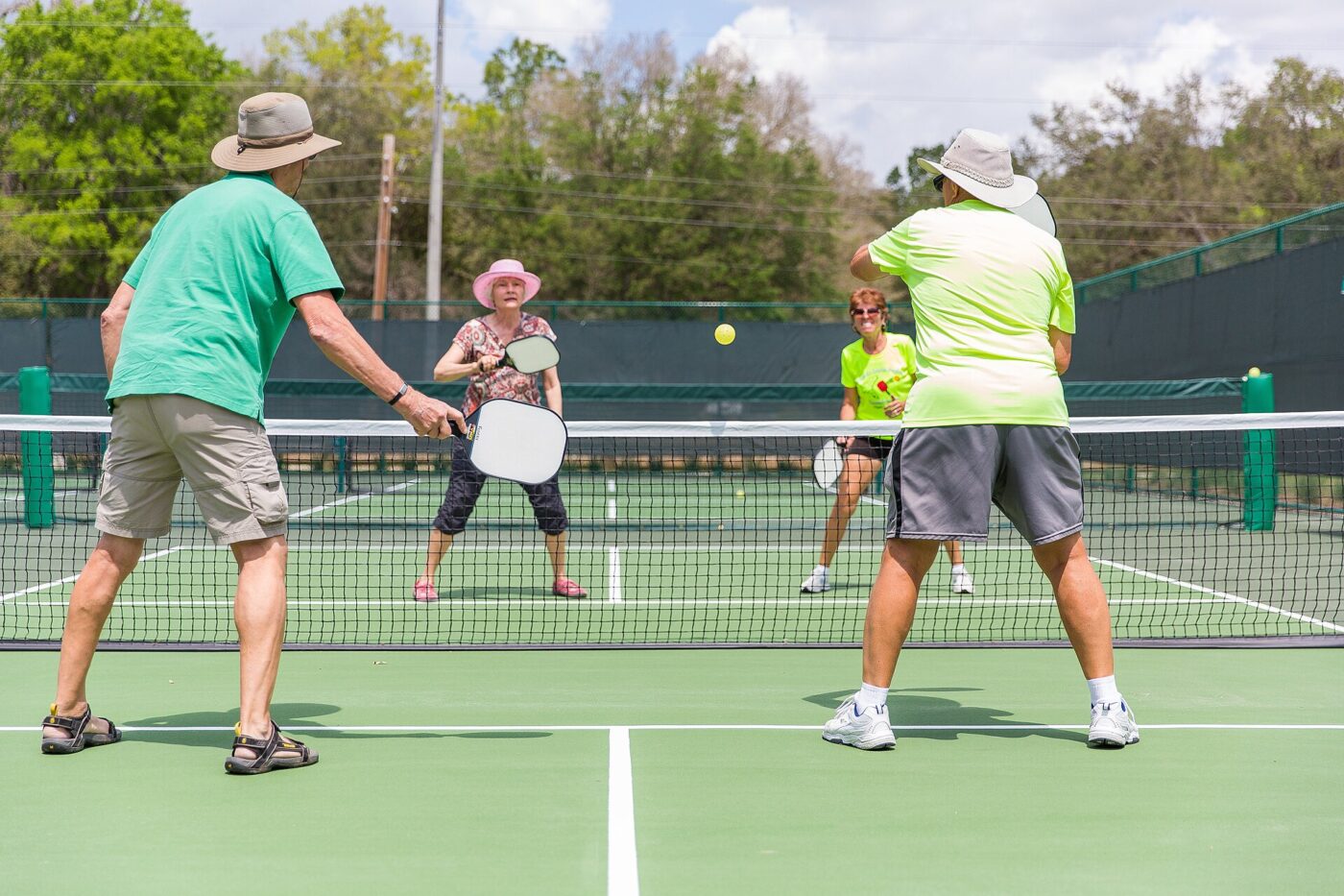 Pickleball players on a court.