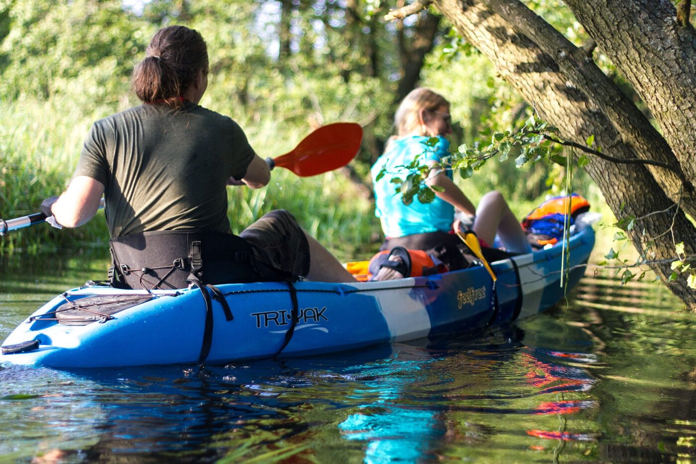 Paddling a tandem sit-on-top kayak.