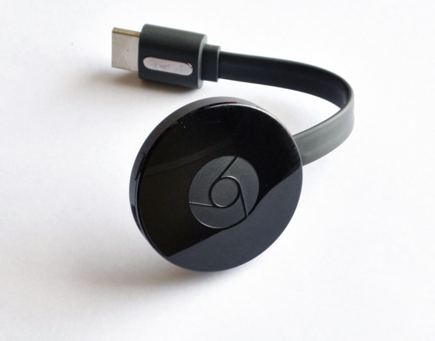 An HDMI streaming device of the kind that hangs off the back of a TV.
