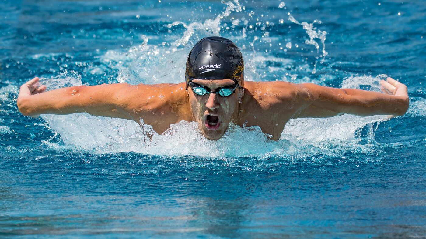 A competitive swimmer in goggles and cap.