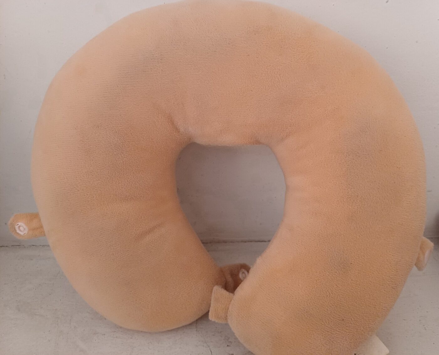 A U-shaped neck pillow.