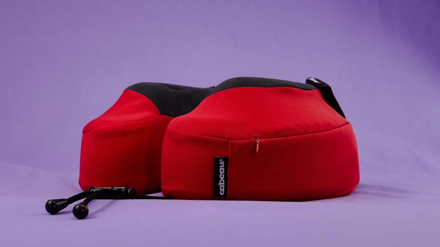 A memory-foam travel pillow with a zip-off cover.