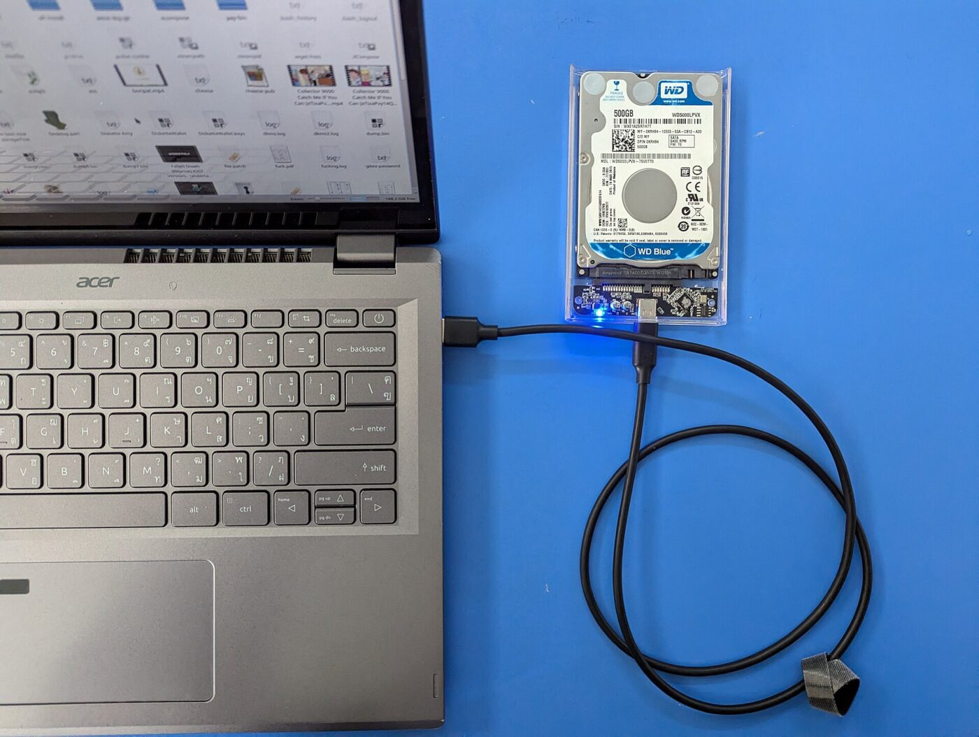 An external hard drive connected to a laptop over USB-C.