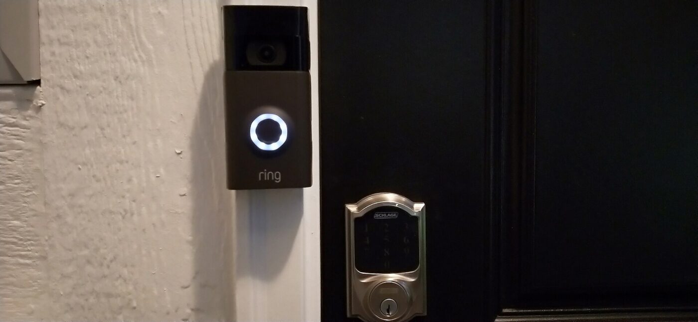 A doorbell camera and a smart lock at the same entrance.