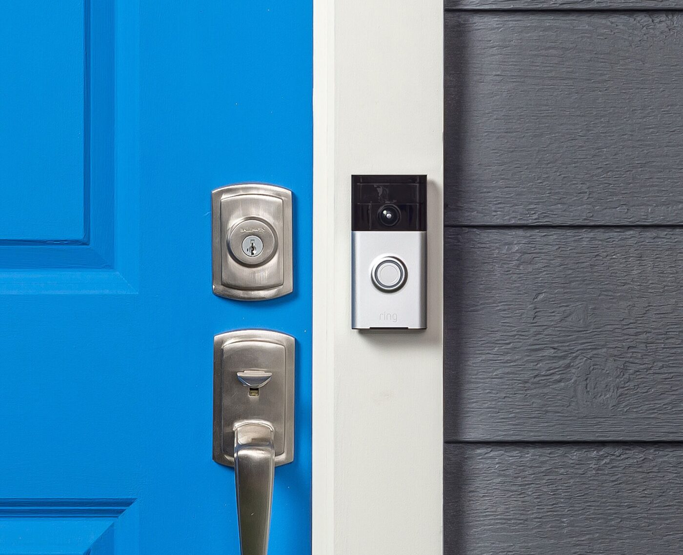A video doorbell mounted beside a front door.