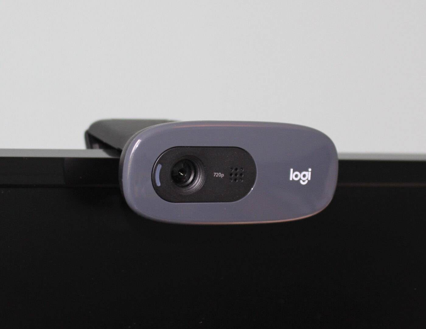 A webcam clipped to the top of a computer screen.